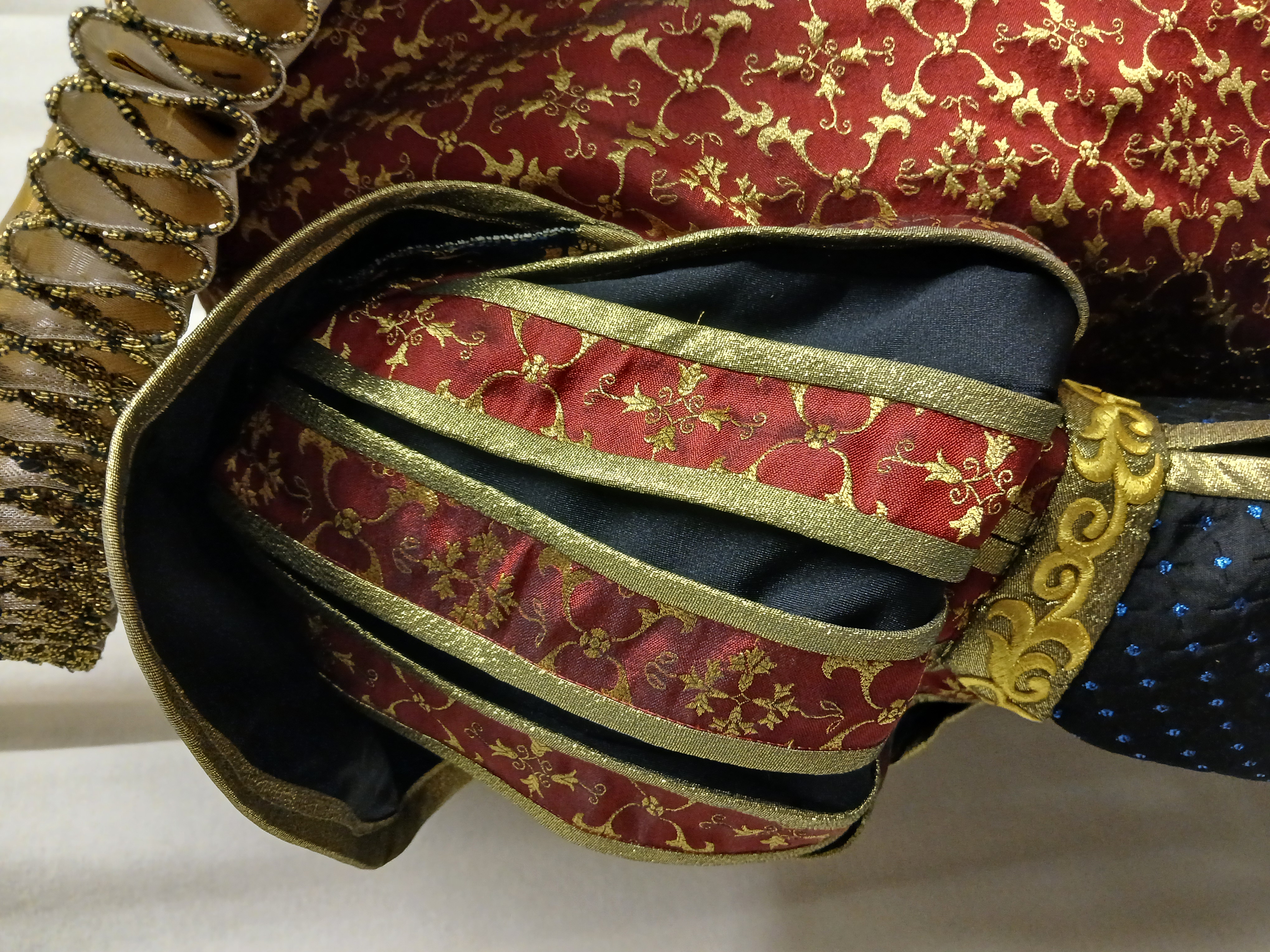 Masquerade Costume B — close-up detail of shoulder/sleeve